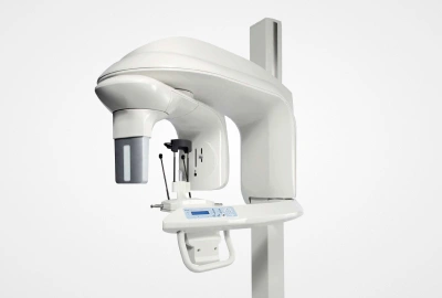 Panoramic dental X-ray machine mounted on adjustable arm in clinical setting